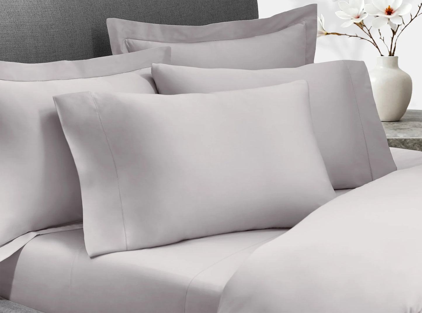 Quiet gray organic cotton sateen bedding bundle styled on a bed - complete luxury bedroom set-quiet-gray