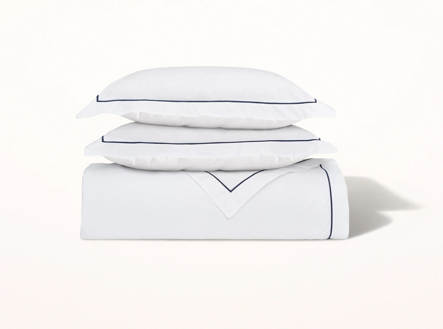 Organic cotton percale duvet cover with navy blue embroidered detail on white