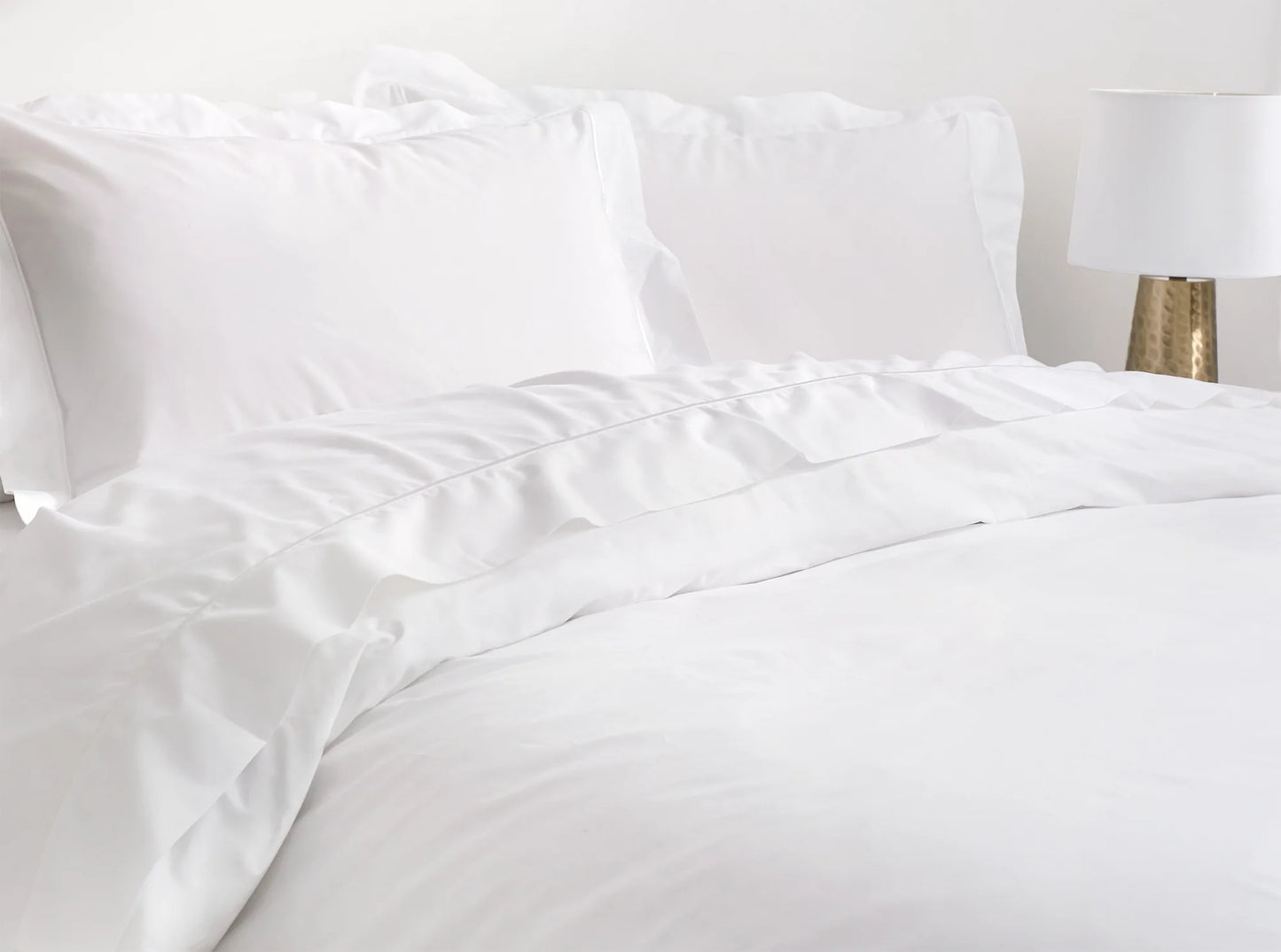 Complete organic percale bedding with embroidered duvet cover and sheets in white - luxury bedroom